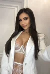 Kaisa is looking very sexy in a white blazer and a white bra 